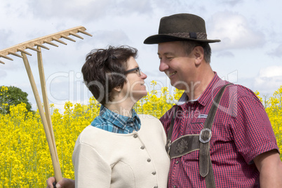 farmer with his wife before the rape field