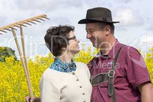 farmer with his wife before the rape field