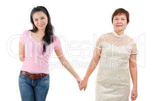 mother and daughter hold hands