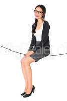 asian woman sitting on a rope