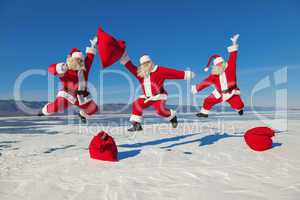 Three Jumping Santa Claus outdoors