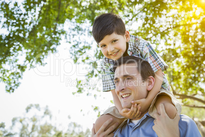 Father and Son Playing Piggyback in the Park