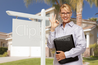 Real Estate Agent in Front of Blank Sign and House