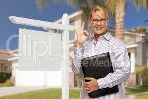 Real Estate Agent in Front of Blank Sign and House