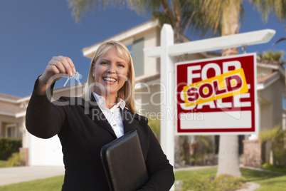 Female Real Estate Agent Handing Over the House Keys