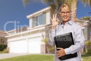 Attractive Businesswoman In Front of Nice Residential Home