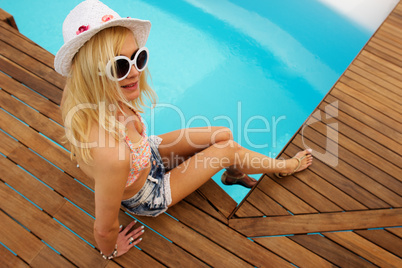 young woman relaxing at the pool