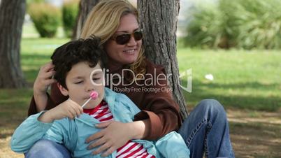 Mother and son relaxing time in park