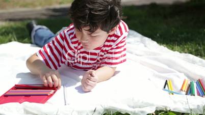 Child painting in the park