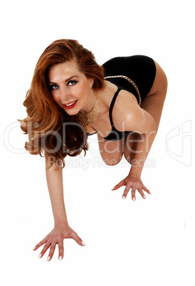woman in corset kneeling.