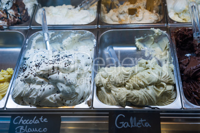 Italian ice cream on display in metal tubs