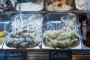Italian ice cream on display in metal tubs