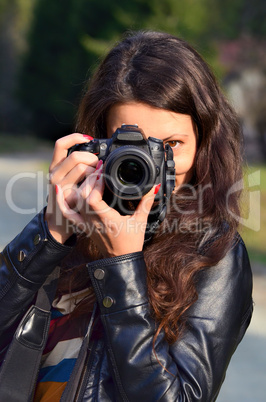 Young woman with DSLR camera