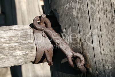 Old metal part on the fence