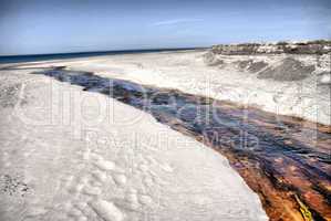 Creek flowing into the sea