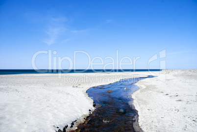 Creek flowing into the sea