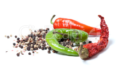 Mix of hot peppers on white background