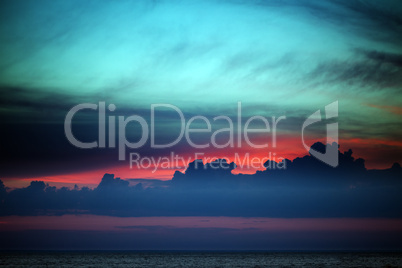 Multicolor sunset sky with clouds on lake