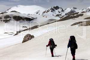 Two hikers on snowy plateau