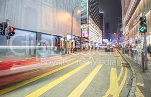 HONG KONG - APRIL 24, 2014: Red taxi cabs car light trails in Ko