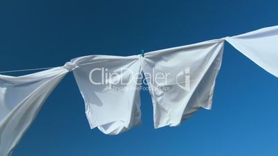 White laundry drying on clothesline