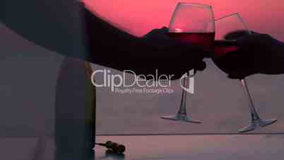 Couple clinking glasses with red wine by the sea at sunset