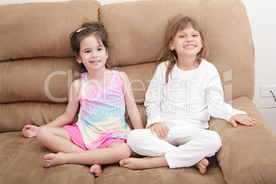 Portrait of two girls in the sofa