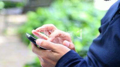 Man Using a Smartphone in park