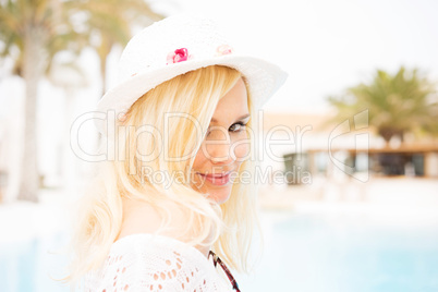 blonde woman by the pool