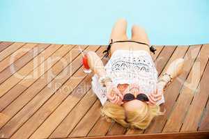 blonde woman by the pool on holiday