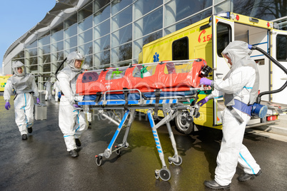 HAZMAT medical team pushing stretcher