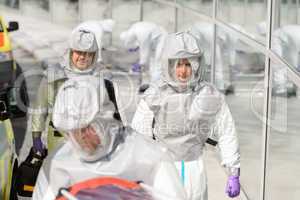 Biohazard medical team in protective uniform