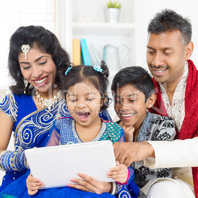indian family using digital computer tablet