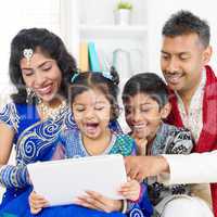 indian family using digital computer tablet