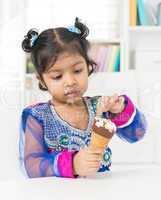 little girl eating ice cream.