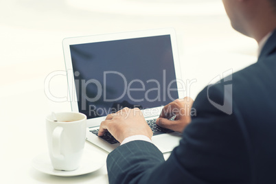 indian businessman using laptop