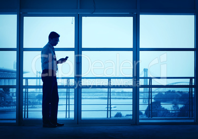 silhouette of asian indian man texting