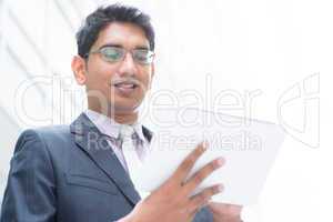 indian businessman using computer tablet
