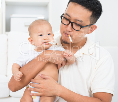 daddy and baby with cigarette