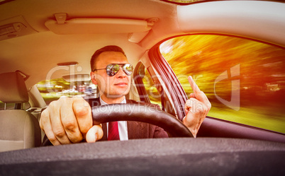 man driving a car.