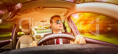 man driving a car.