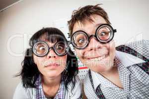 Two person wearing spectacles in an office at the doctor