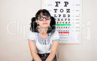 funny woman wearing spectacles in an office at the doctor