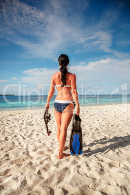 Girl and snorkeling gear