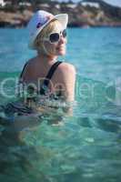 beautiful blonde woman swimming in the sea