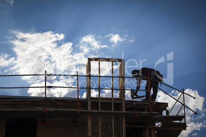 Construction Worker Silhouette on Roof