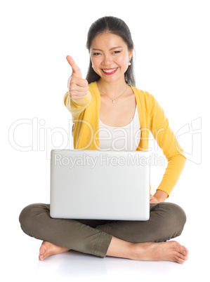 asian girl using laptop pc and thumb up