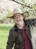Man enjoys the great outdoors under blooming cherry tree