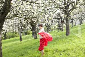 Woman with red cloth with cherry blossom