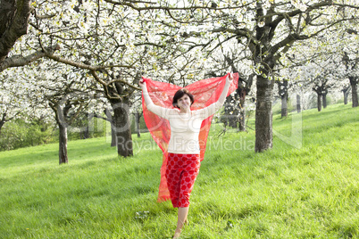 Woman with red cloth with cherry blossom